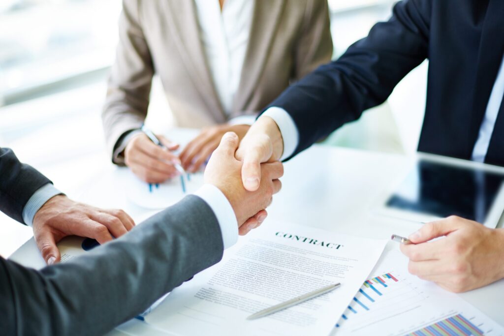 Handshake close up executives scaled.jpg